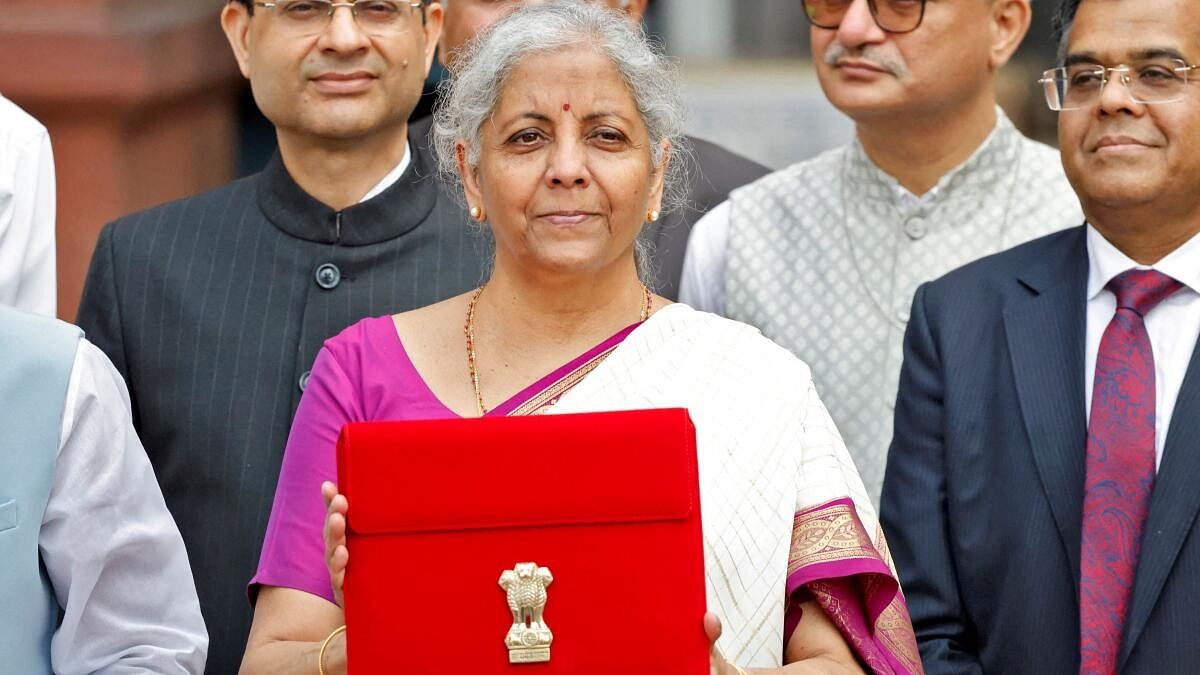 <div class="paragraphs"><p> India's Finance Minister Nirmala Sitharaman holds up a folder with the Government of India's logo as she leaves her office to present the union budget in the parliament in New Delhi.&nbsp;</p></div>