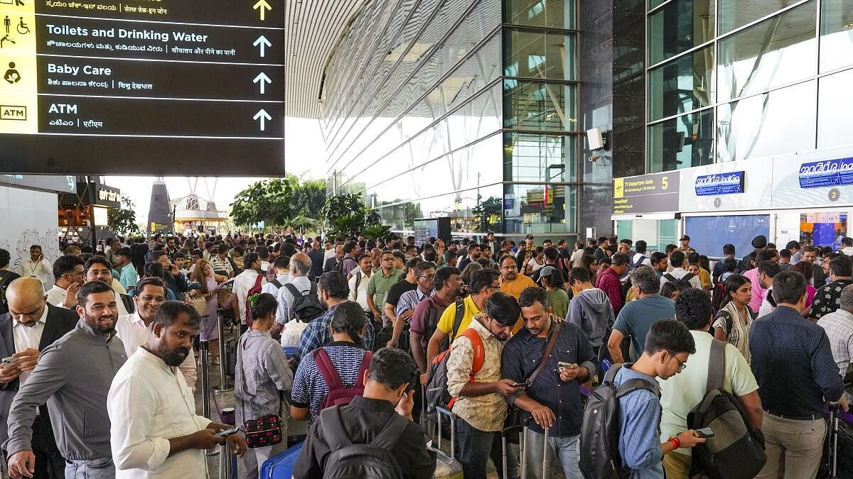 <div class="paragraphs"><p>Stranded passengers at the Kempegowda International Airport Bengaluru amid Microsoft outage, in Bengaluru, Friday, July 19, 2024. Indigo, Air India Express, SpiceJet and Akasa at the Bengaluru airport began checking in passengers manually on Friday, issuing handwritten boarding passes, after a global Microsoft outage led to the Navitaire Departure Control System stalling.</p></div>