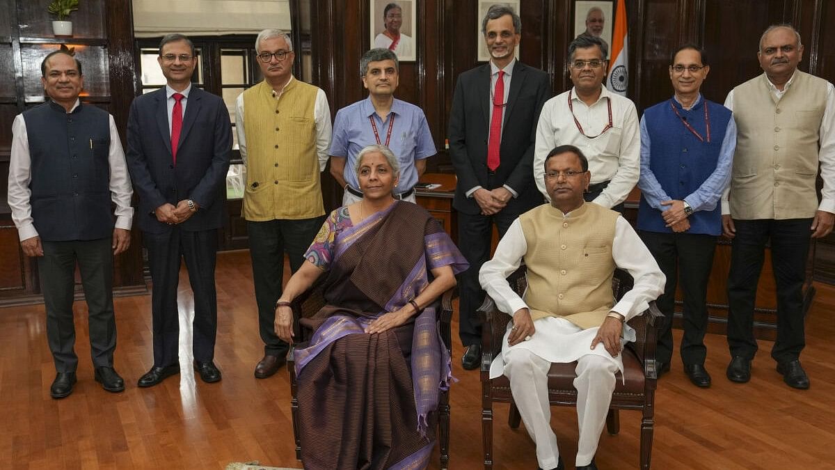 <div class="paragraphs"><p>Union Finance Minister Nirmala Sitharaman with Pankaj Chaudhary and the budget team  giving final touches to the Union Budget in New Delhi on Monday, July 22, 2024.</p></div>