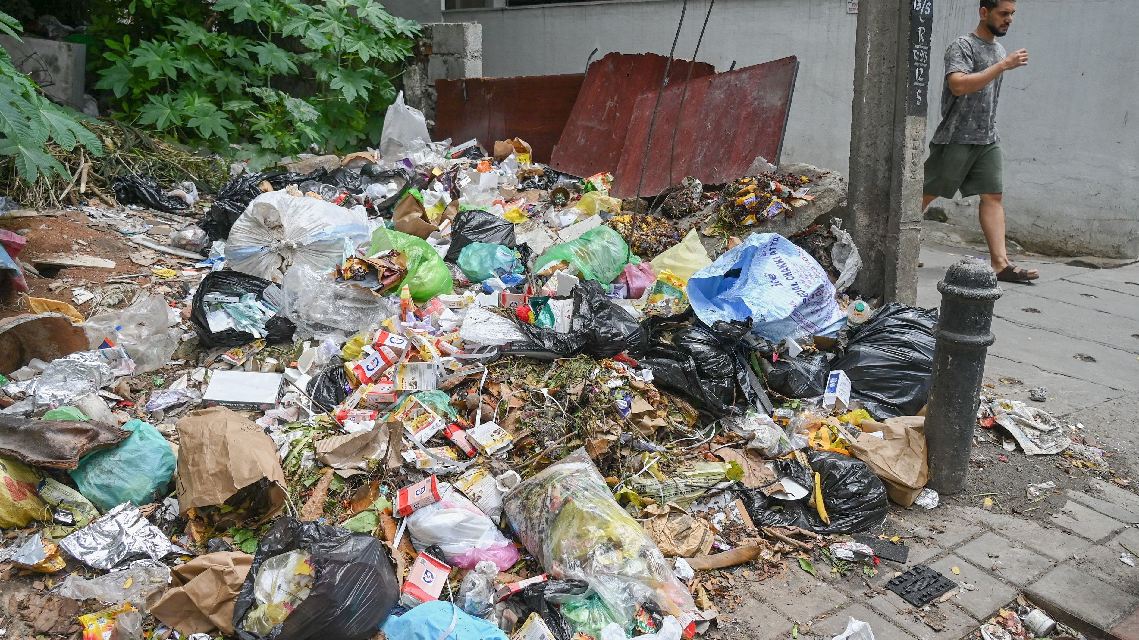 <div class="paragraphs"><p>Food waste and construction debris is being dumped along Gangadhar Chetty Road. </p></div>