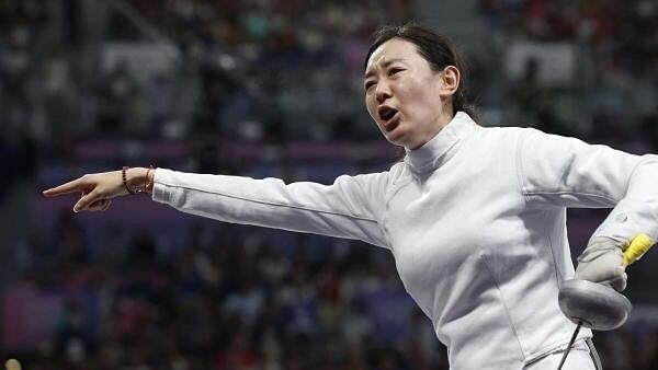 <div class="paragraphs"><p>Yiwen Sun of China gestures while talking to the referee.</p></div>