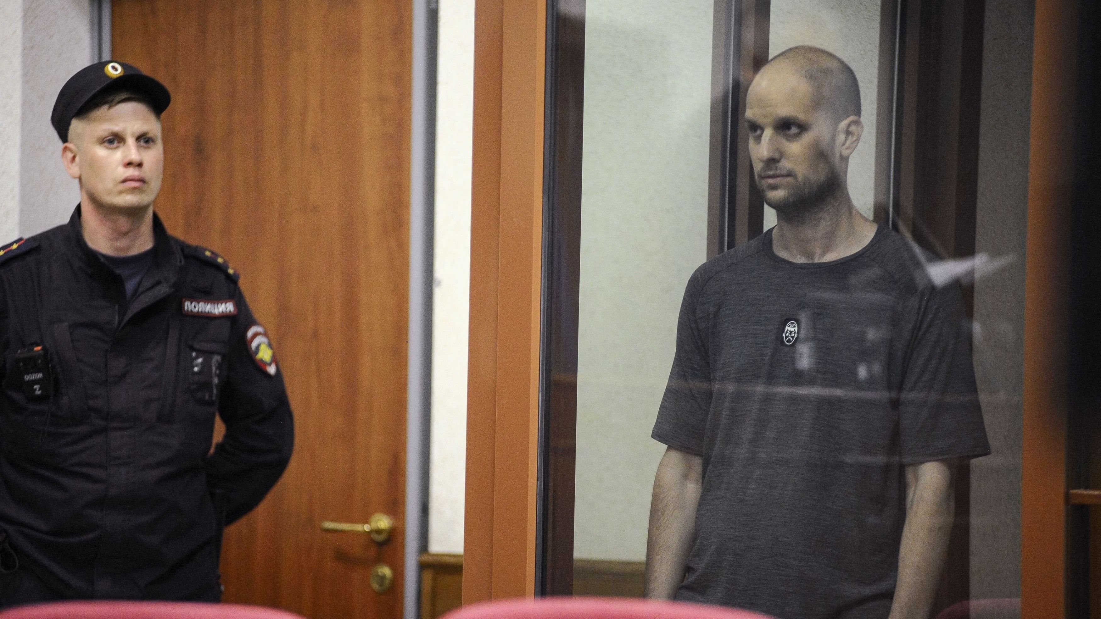 <div class="paragraphs"><p>Wall Street Journal reporter Evan Gershkovich, who faces charges of espionage, stands inside an enclosure for defendants as he attends a court hearing in Yekaterinburg, Russia July 19, 2024. </p></div>