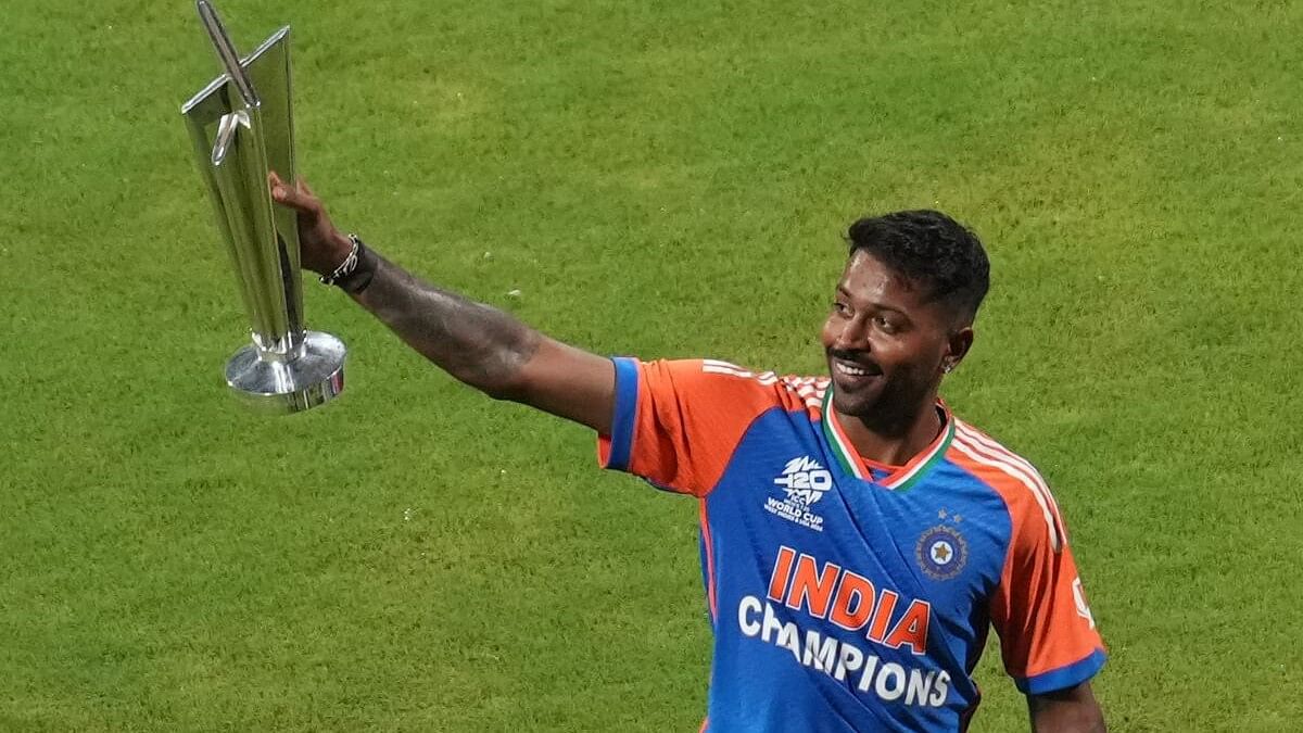 <div class="paragraphs"><p>Hardik Pandya holds the T20 World Cup trophy during a felicitation ceremony at the Wankhede Stadium, in Mumbai.&nbsp;</p></div>