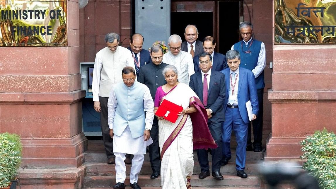 <div class="paragraphs"><p>Nirmala Sitharaman holds a folder with the Government of India's logo while leaving her office to present the union budget in the parliament in New Delhi.&nbsp;</p></div>