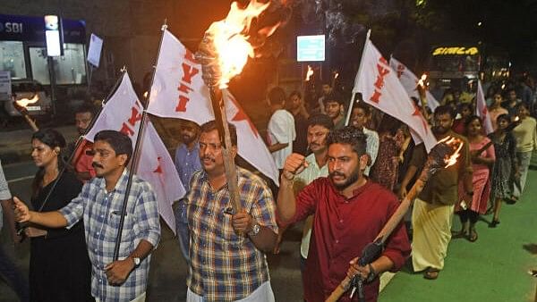 <div class="paragraphs"><p>DYFI (Democratic Youth Federation of India) members take part in torch light procession in a protest march against the alleged neglect of Kerala in the Central budget, in Kochi, Tuesday, July 23, 2024.</p></div>