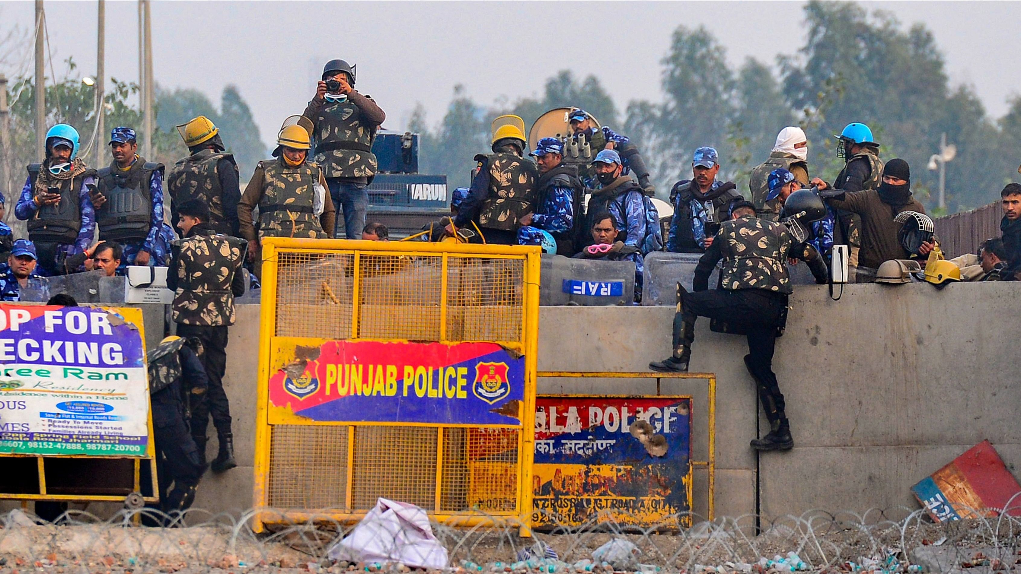 <div class="paragraphs"><p>Security personnel stand guard during the farmers' protest over various demands, including a legal guarantee on the minimum support price (MSP) for crops and farm loan waiver, at the Punjab-Haryana Shambhu Border, in Patiala district, Tuesday, Feb. 20, 2024.</p></div>