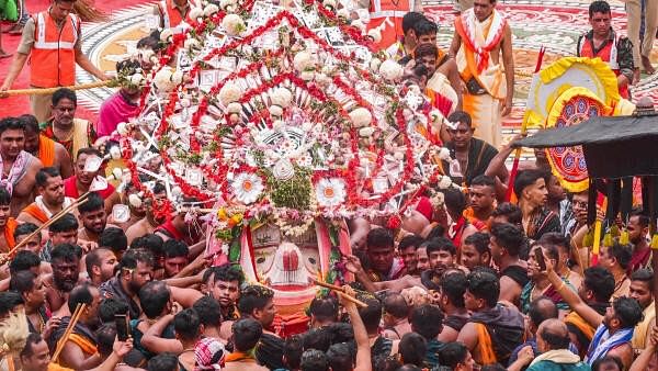 <div class="paragraphs"><p>Devotees carry an idol during the annual ‘Rath Yatra’, in Puri, Sunday, July 7, 2024. </p></div>