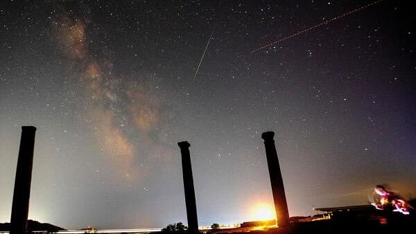 <div class="paragraphs"><p>A long exposure shot shows the Milky Way, a meteor and an airplane over the columns in the ancient city of Stobi, near Stip, North Macedonia on July 10, 2024.</p></div>