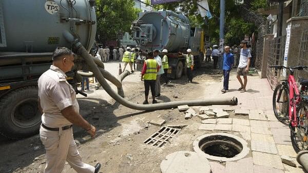 <div class="paragraphs"><p>Vacuum trucks parked near a UPSC exam coaching centre to pump out water from the flooded basement of the coaching centre, in New Delhi, Sunday, July 28, 2024.</p></div>