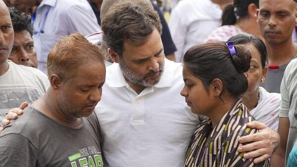 <div class="paragraphs"><p>Leader of Opposition Rahul Gandhi consoles family members of the victims of Hathras stampede incident.</p></div>