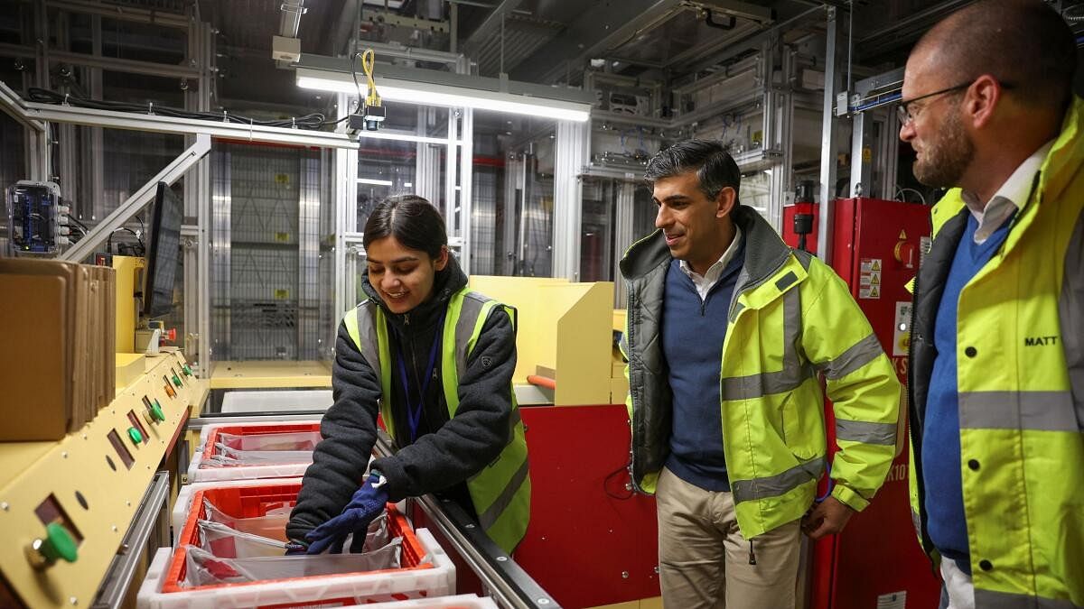 <div class="paragraphs"><p>British Prime Minister Rishi Sunak picks up groceries during a visit to Ocado distribution centre on the day of a Conservative general election campaign event, near Luton.</p></div>