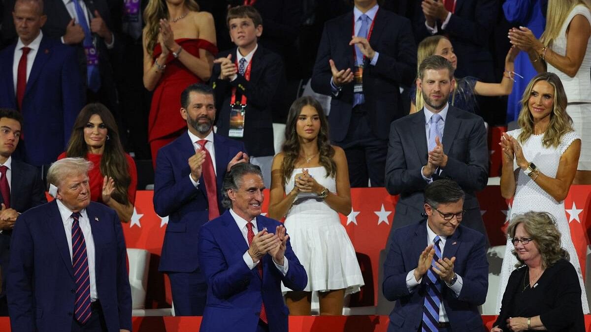 <div class="paragraphs"><p>House Speaker Mike Johnson speaks with the mother of vice presidential candidate J.D. Vance, Beverly, as Republican presidential nominee and former US President Donald Trump looks on and North Dakota Governor Doug Burgum applauds, on Day 3 of the Republican National Convention (RNC), at the Fiserv Forum in Milwaukee, Wisconsin, US, July 17, 2024. </p></div>