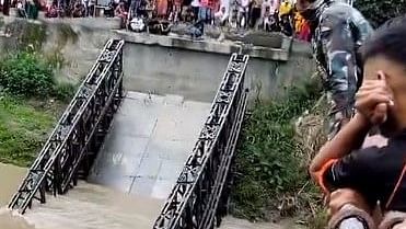 <div class="paragraphs"><p>Screengrab of a video showing a bridge that collapsed at Mutum Phibou of Imphal in Manipur.</p></div>