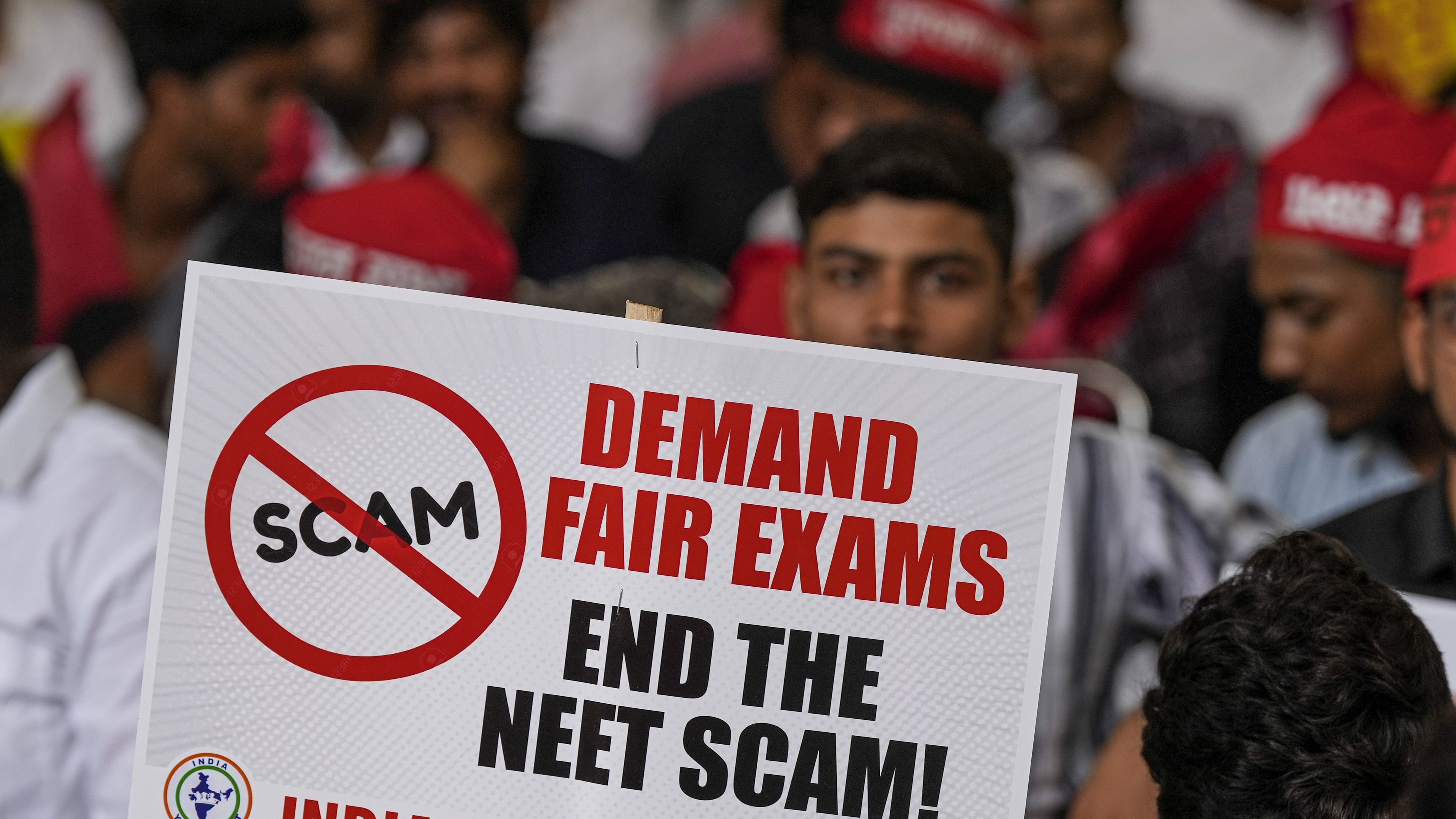 <div class="paragraphs"><p>An agitator holds a placard during a protest.</p></div>