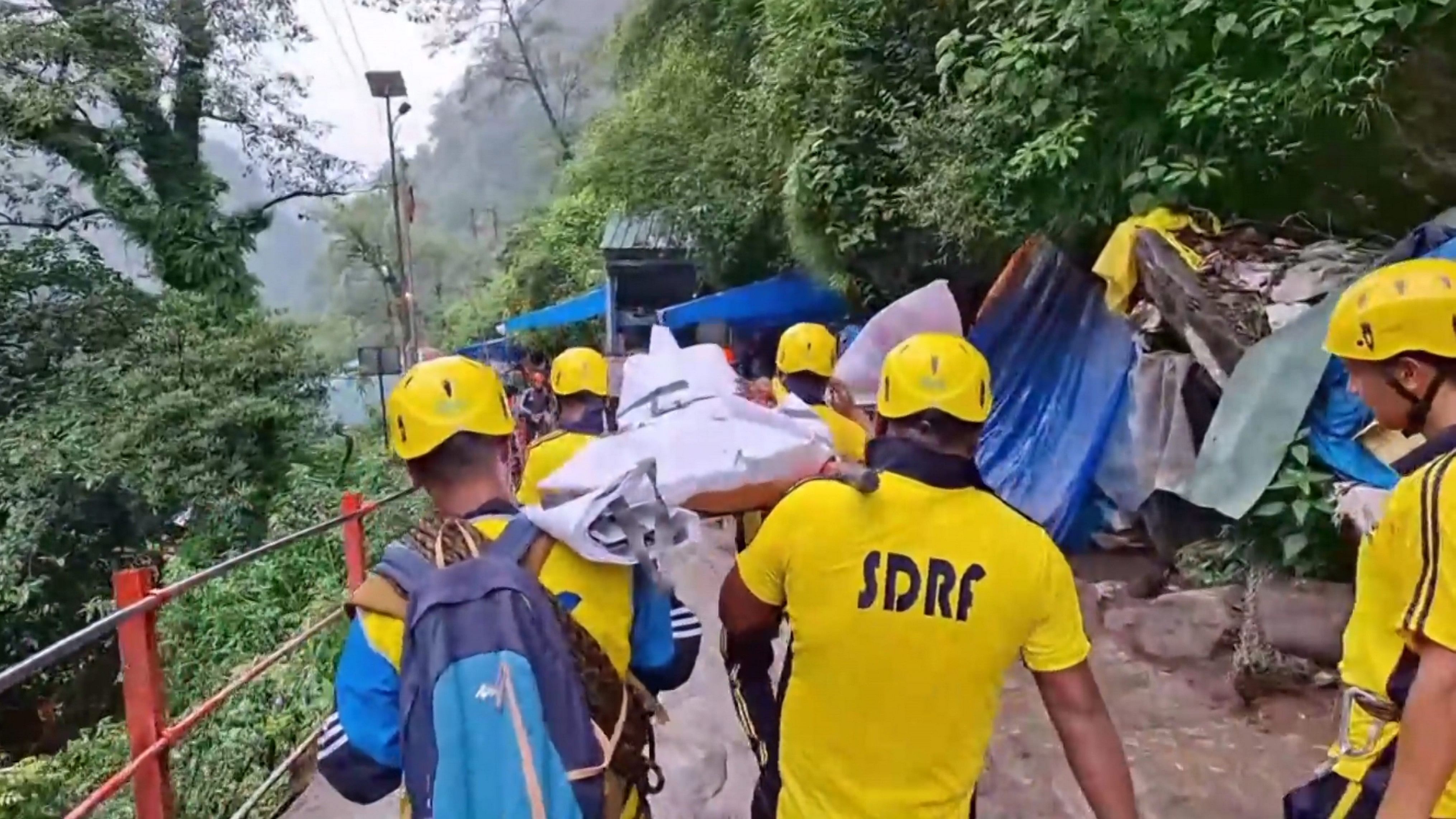 <div class="paragraphs"><p>SDRF personnel conduct a rescue operation following a landslide on the Kedarnath trekking route, in Rudraprayag district, Sunday, July 21, 2024.</p></div>