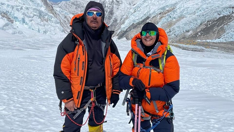 <div class="paragraphs"><p>Dr Usha (right) with the sherpa who led the expedition.</p></div>