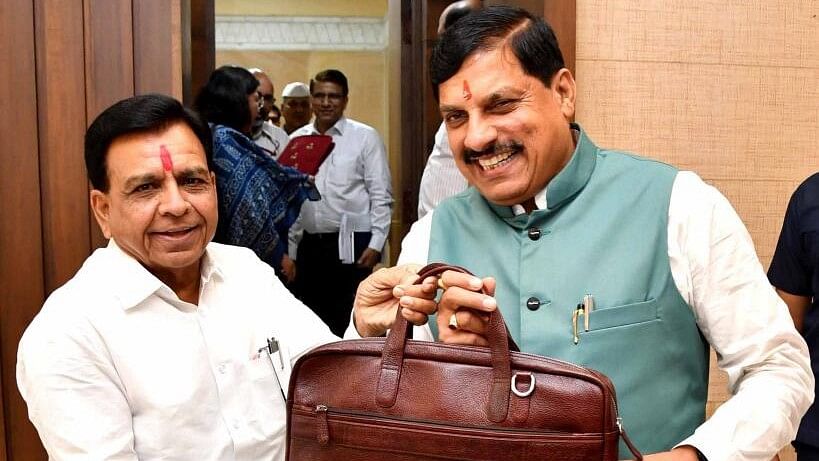 <div class="paragraphs"><p>Madhya Pradesh Chief Minister Mohan Yadav with Deputy CM and Finance Minister Jagdish Devda before presentation of the annual budget in the State Legislative Assembly during the ongoing Monsoon session, in Bhopal, Wednesday, July 3, 2024.</p></div>