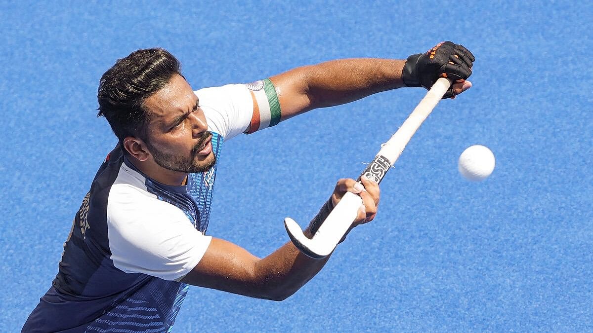 <div class="paragraphs"><p>India's captain Harmanpreet Singh controls the ball during the Pool B hockey match between India and Ireland at the 2024 Summer Olympics, in Paris, France, Tuesday, July 30, 2024.</p></div>