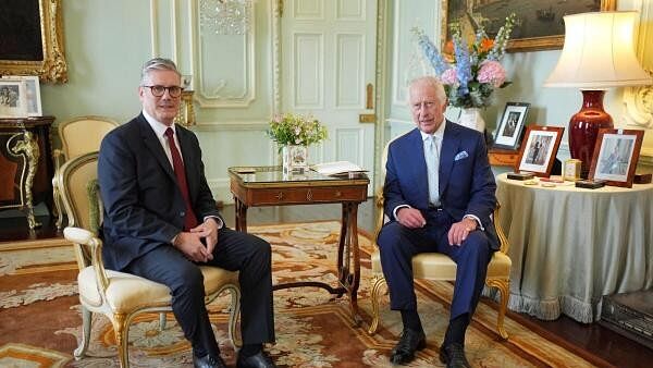 <div class="paragraphs"><p>Britain's King Charles talks with Sir Keir Starmer during an audience at Buckingham Palace, where he invited the leader of the Labour Party to become Prime Minister and form a new government</p></div>