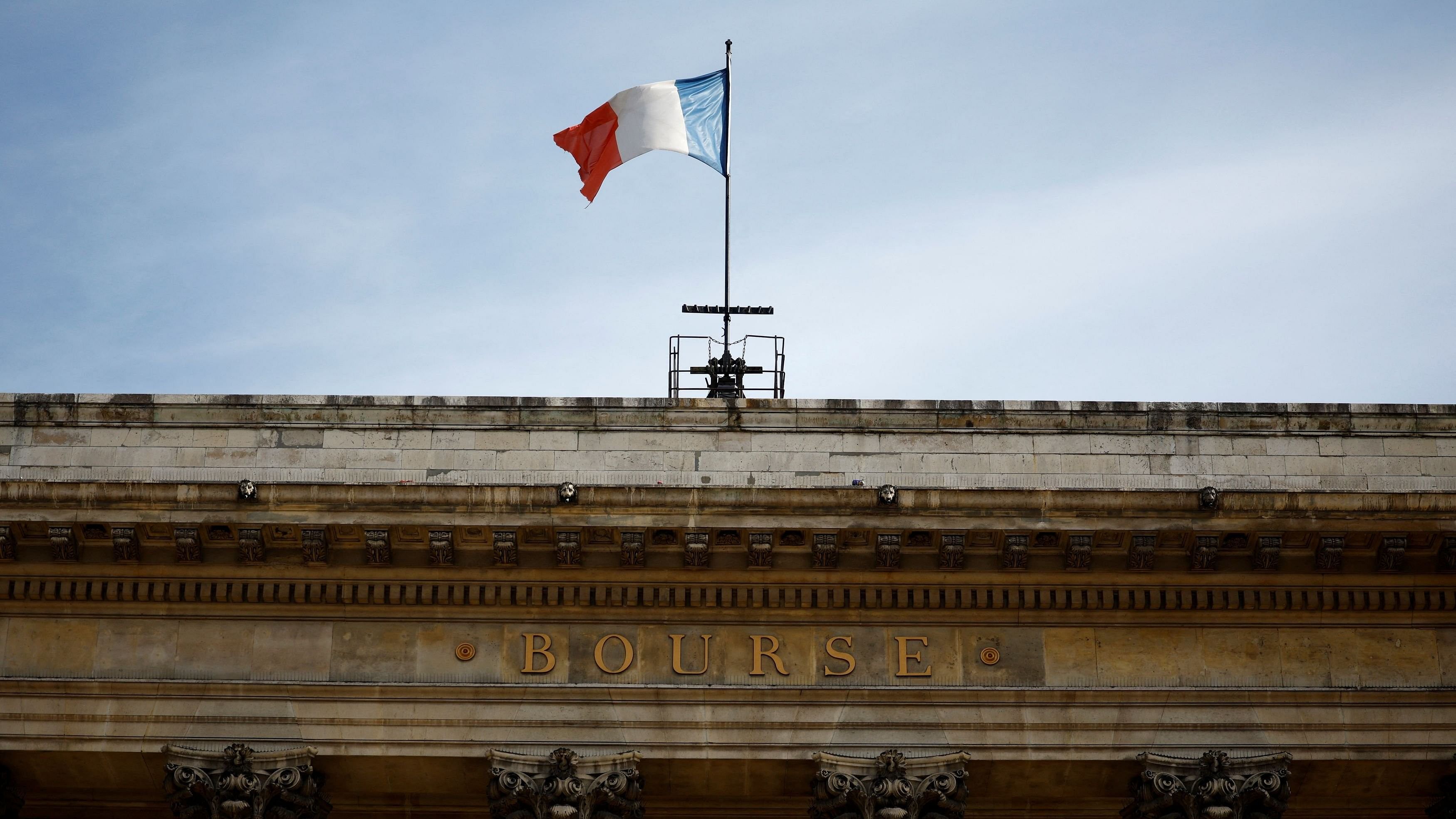 <div class="paragraphs"><p>A French national flag waves on the Palais Brongniart, former Paris Stock Exchange, located at Place de la Bourse in Paris.</p></div>