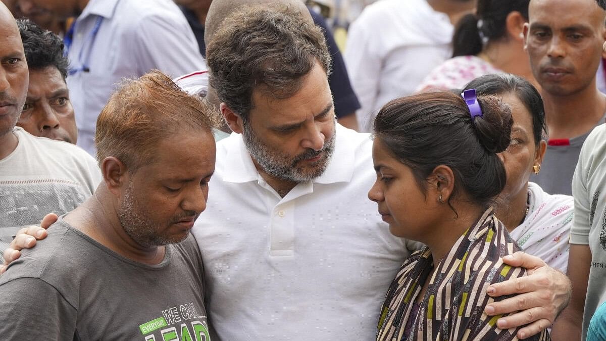 <div class="paragraphs"><p>Congress leader Rahul Gandhi consoles family members of the victims of Hathras stampede incident.</p></div>