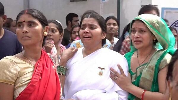 <div class="paragraphs"><p>Family members mourn during funeral of Special Task Force (STF) constable Bharat Lal Sahu, who was killed in a blast triggered by Maoists in Chhattisgarh's Bijapur district, in Raipur, Friday, July 19, 2024.</p></div>