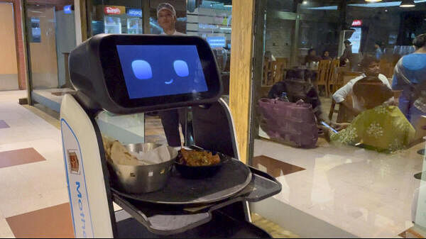 <div class="paragraphs"><p>A robot named ‘Ananya’ serves food at Mother's Hut restaurant near Krishnanagar, in Nadia district.</p></div>