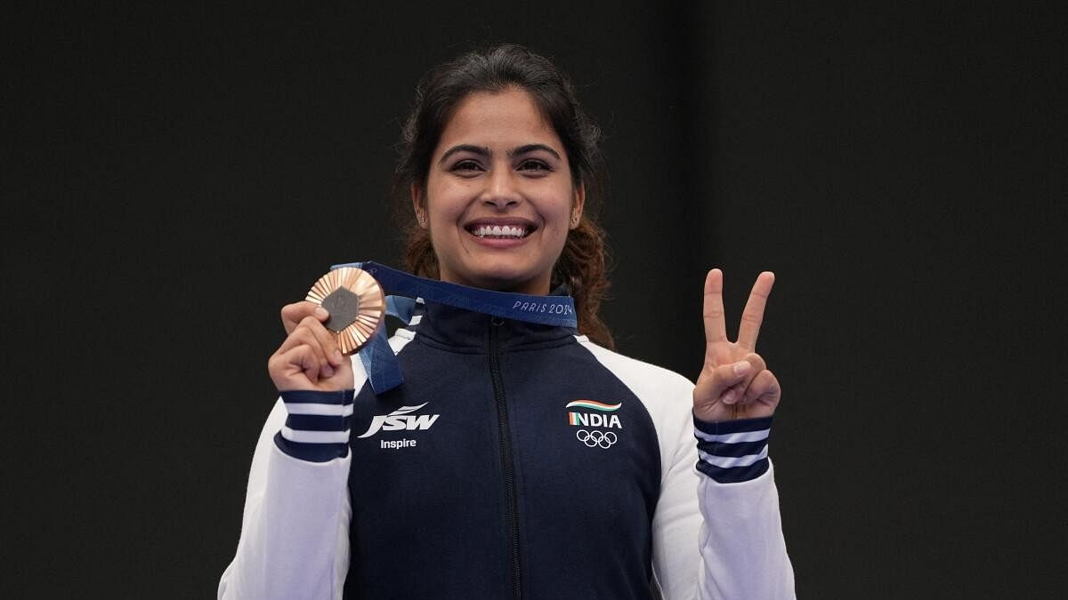 <div class="paragraphs"><p>Manu Bhaker of India poses with her bronze medal.</p></div>