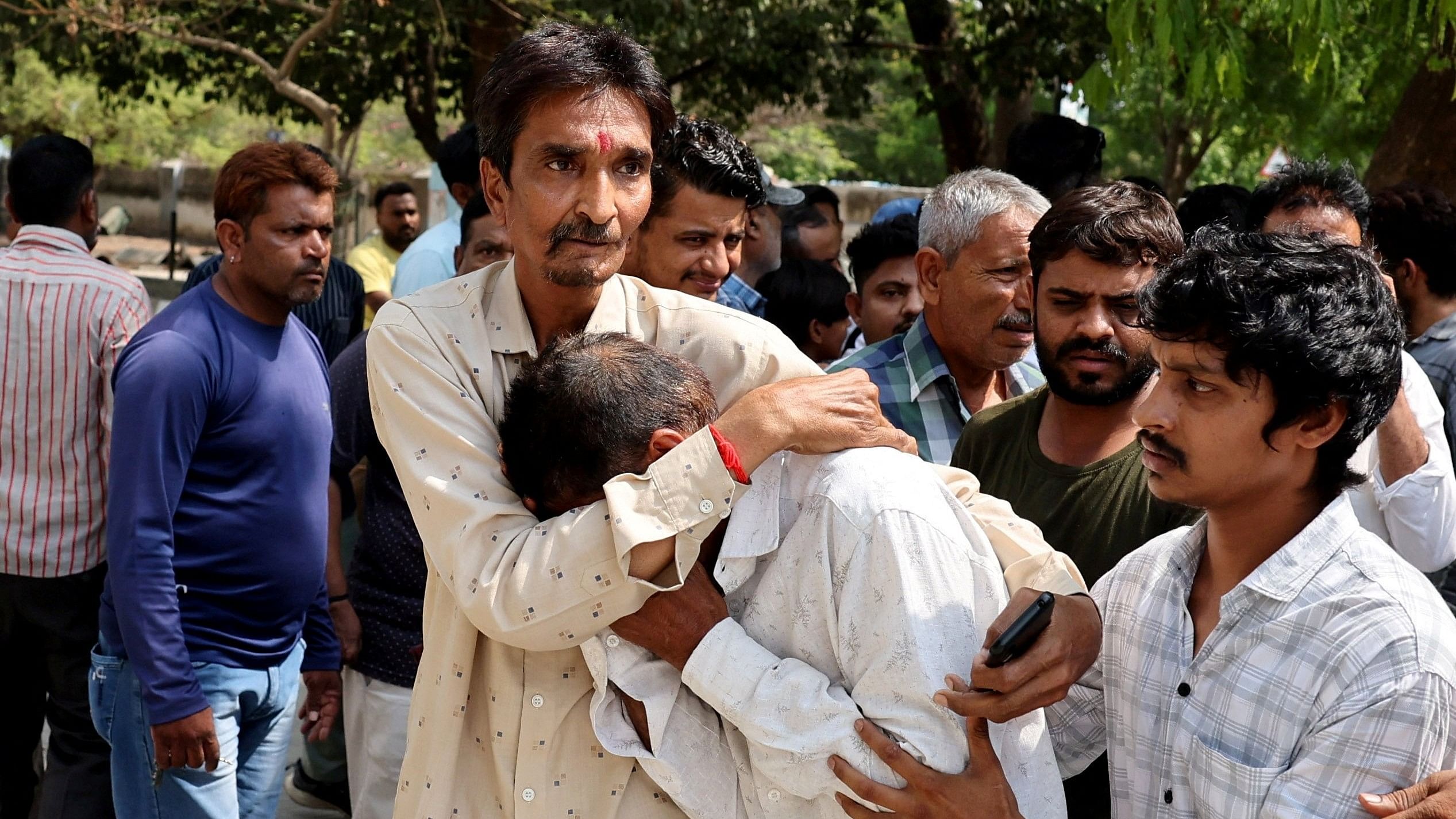 <div class="paragraphs"><p>A man is being consoled outside a hospital morgue as he waits for the body of his relative who was killed in the fire in a gaming zone in Rajkot, in the western state of Gujarat, India, May 26, 2024. Representative image.</p></div>