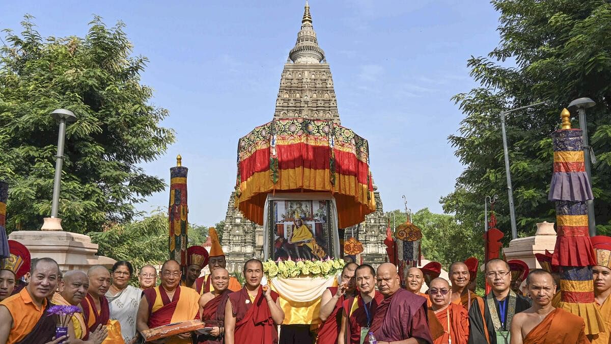 <div class="paragraphs"><p>Buddhist monks during celebrations of the 89th birthday of Tibetan spiritual leader the Dalai Lama, at Mahabodhi temple, in Bodh Gaya.</p></div>