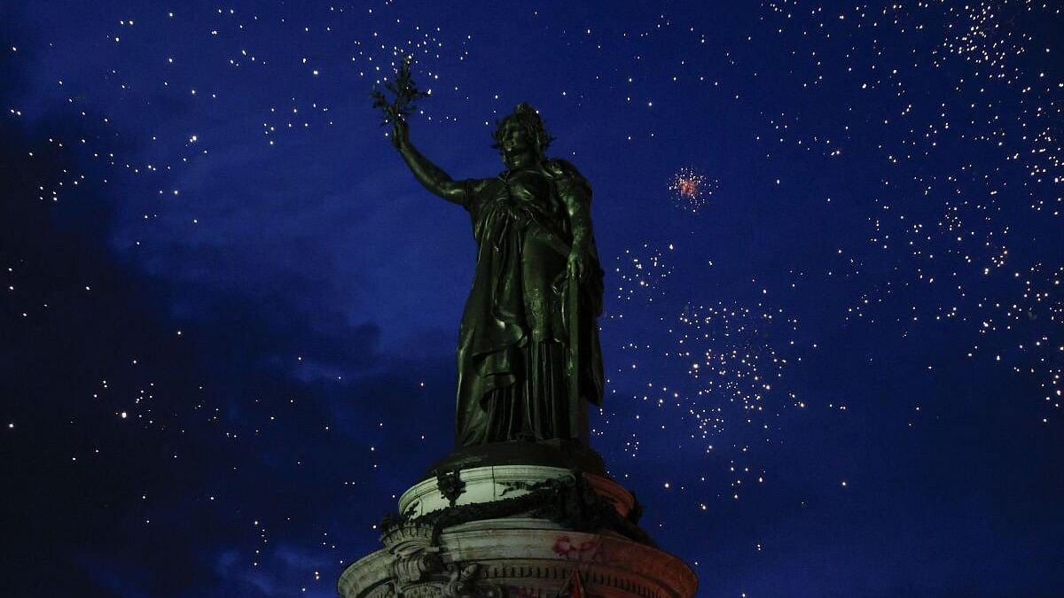 <div class="paragraphs"><p>The statue of Marianne is seen among fireworks as people gather at the Place de la Republique after partial results in the second round of the early French parliamentary elections, in Paris. </p><p></p></div>