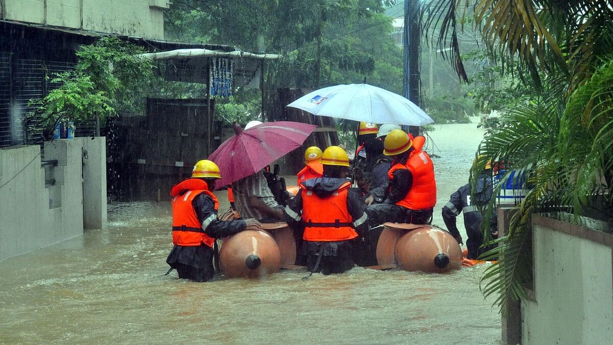 <div class="paragraphs"><p>People being evacuated from a barangay in Udupi city.</p></div>