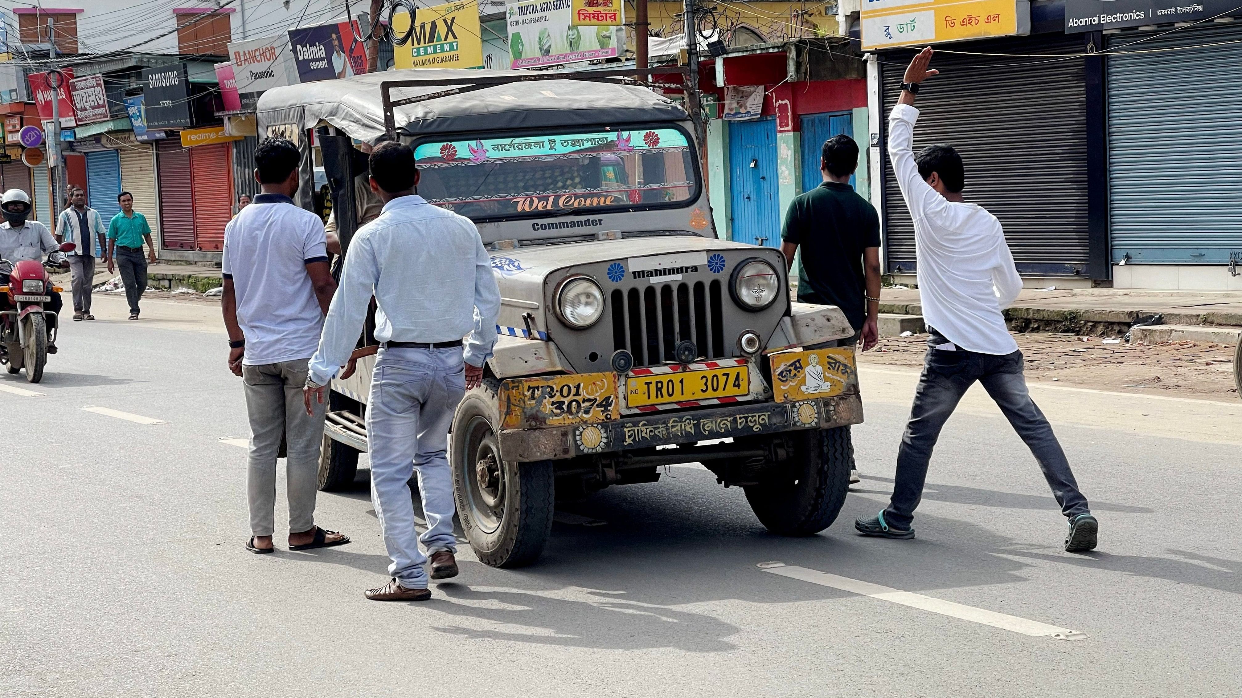 <div class="paragraphs"><p> Picketers stop a vehicle during the 12-hour all-Tripura strike called by CPIM in protest against the killing of party candidate.</p></div>