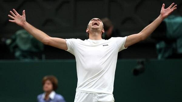 <div class="paragraphs"><p>Wimbledon - All England Lawn Tennis and Croquet Club, London, Britain -  Taylor Fritz of the US celebrates after winning his fourth round match against Germany's Alexander Zverev.</p></div>