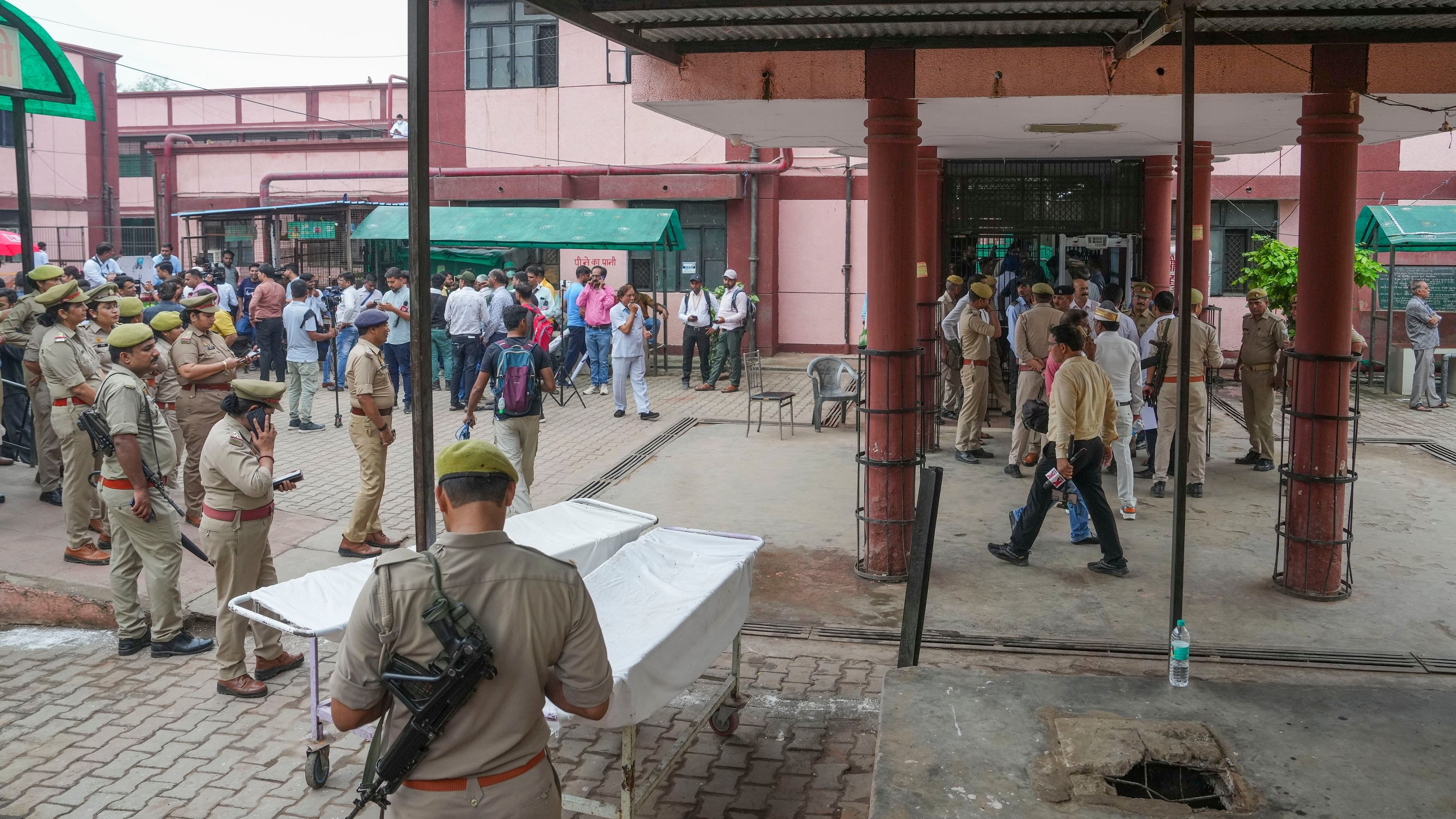 <div class="paragraphs"><p>Hathras: Police personnel keep vigil outside a hospital during Uttar Pradesh CM Yogi Adityanath's visit to meet the injured victims a day after the stampede that occurred during a 'satsang' (religious congregation), in Hathras district, Wednesday, July 3, 2024. </p></div>