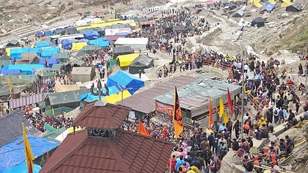 <div class="paragraphs"><p>Devotees arrive at the Amarnath Temple to offer prayers during the annual ‘Amarnath Yatra’, in Anantnag district.</p></div>