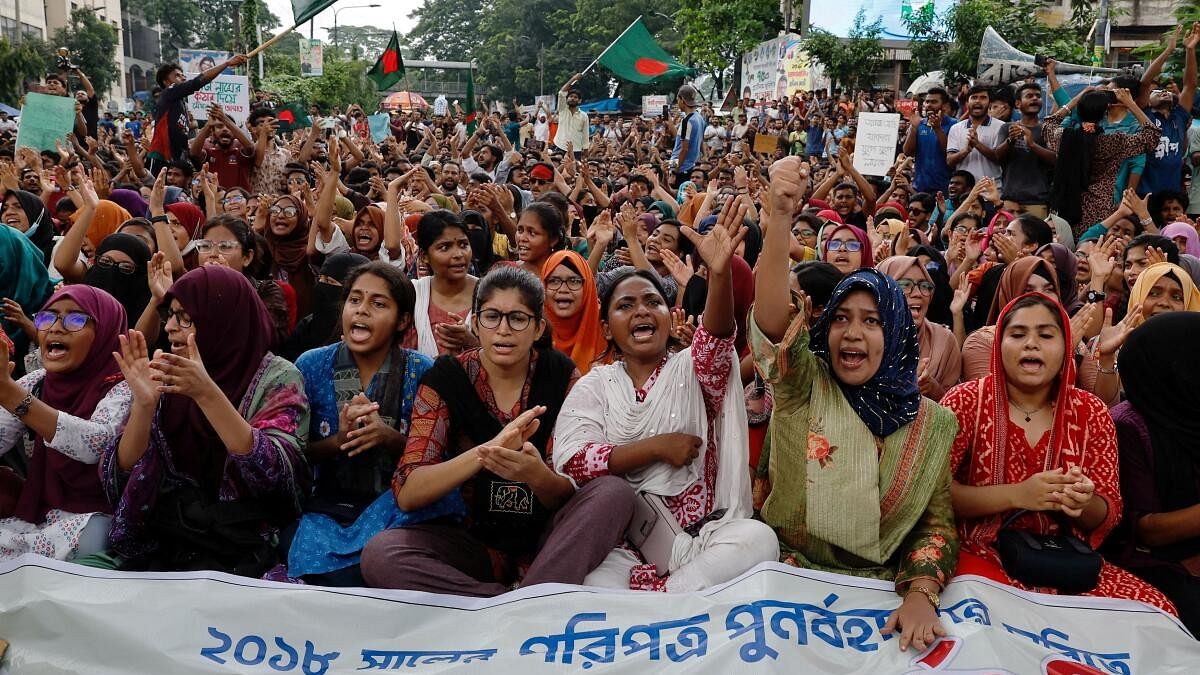 <div class="paragraphs"><p>Students and job seekers shouts slogans as they protest to ban quotas for government job at Shahbagh Square in Dhaka, Bangladesh.</p></div>