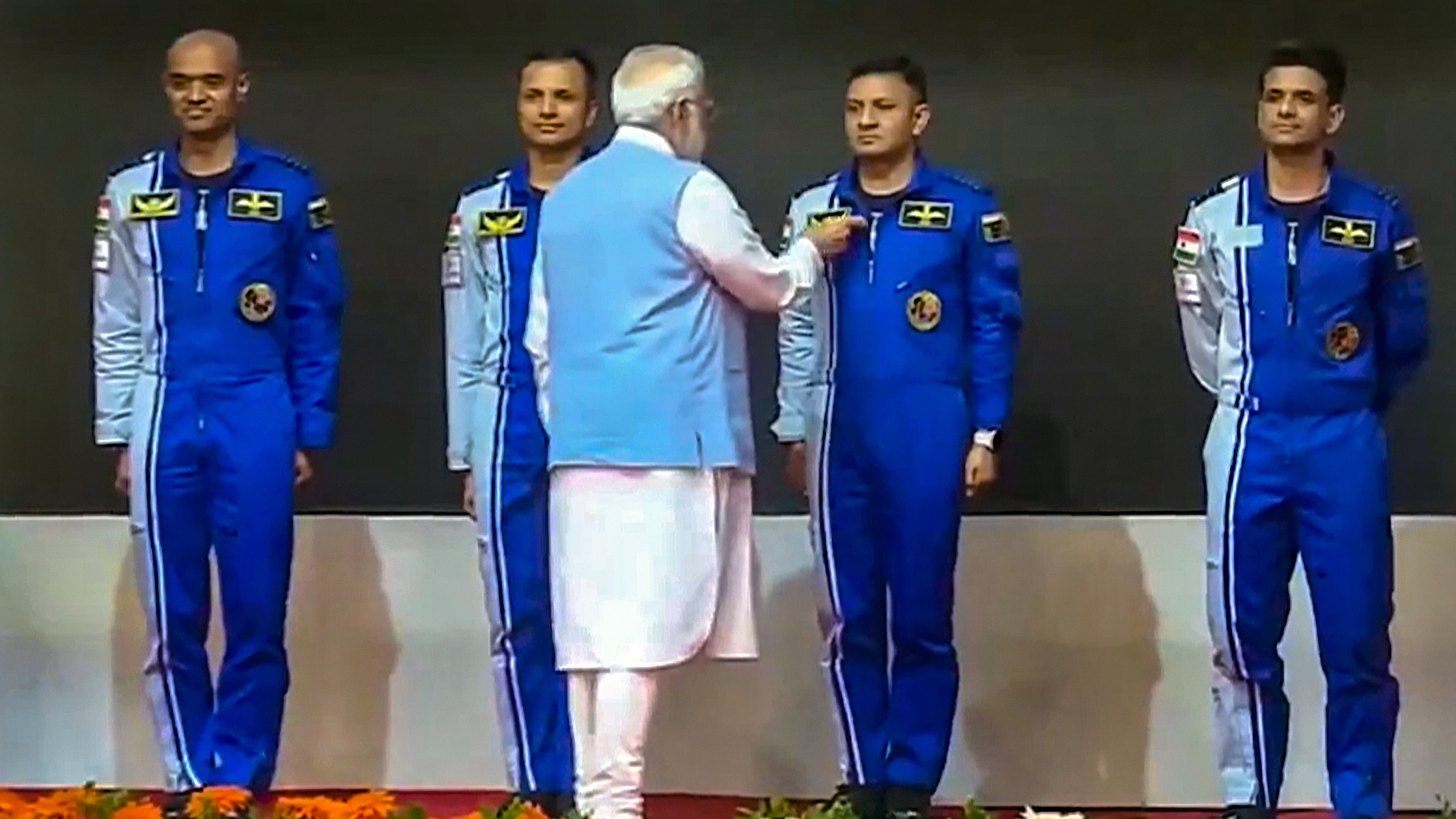 <div class="paragraphs"><p>Prime Minister Narendra Modi hands-over wings to astronauts-designate Shubanshu Shukla, Prashanth Balakrishnan Nair, Angad Prathap and Ajit Krishnan who have been selected to be the astronauts on India's first crewed mission to space 'Gaganyaan Mission', at the Vikram Sarabhai Space Centre (VSSC), in Thiruvananthapuram, Tuesday, Feb. 27, 2024. </p></div>