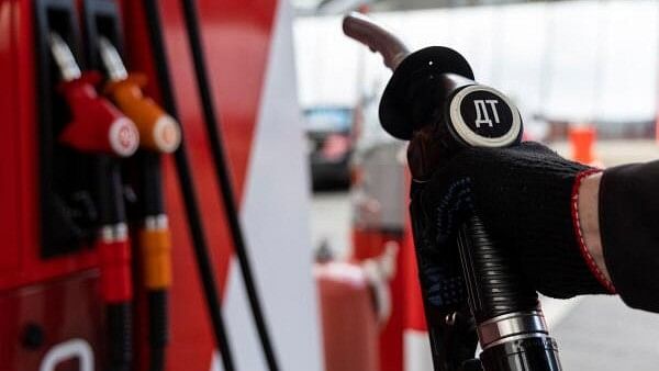 <div class="paragraphs"><p>An employee holds a diesel fuel pump nozzle at a petrol station of Neftmagistral company in Moscow, Russia</p></div>