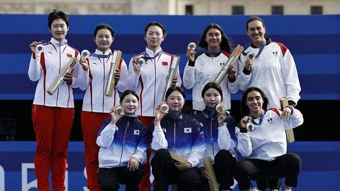 <div class="paragraphs"><p>Suhyeon Nam of South Korea, Sihyeon Lim of South Korea and Hunyoung Jeon of South Korea celebrate after winning gold together with silver medalists Qixuan An of China, Xiaolei Yang of China, Jiaman Li of China and bronze medalists Ana Vazquez of Mexico, Angela Ruiz of Mexico and Alejandra Valencia of Mexico</p></div>