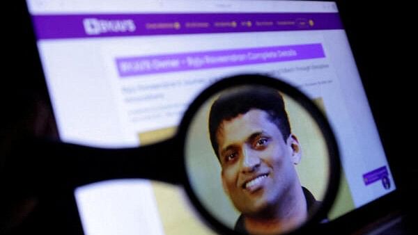 <div class="paragraphs"><p>Illustration shows Byju's Owner Byju Raveendran photo on his company web page</p></div>