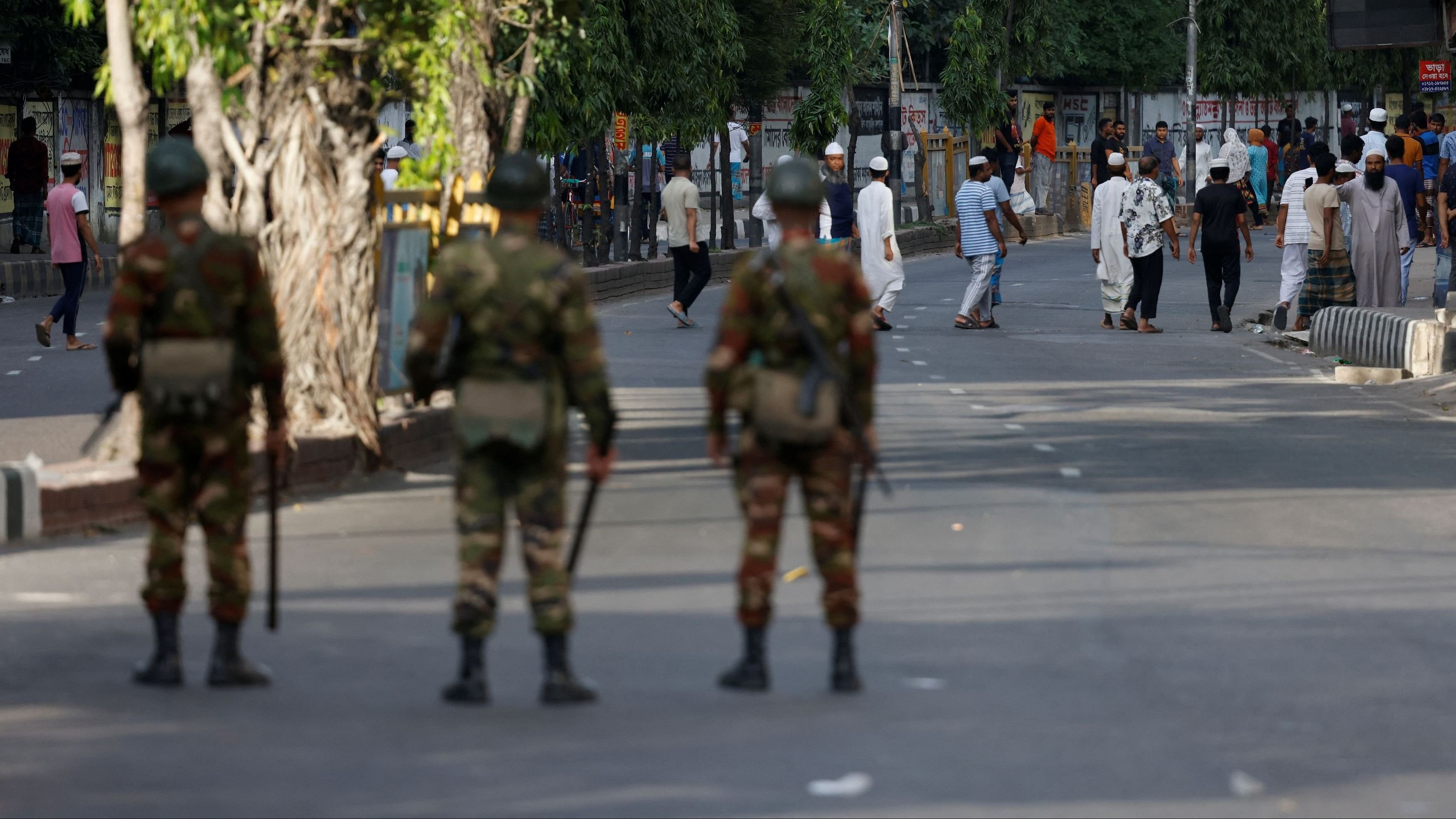 <div class="paragraphs"><p>People roam on the street after curfew has been proclaimed and army deployment in the country, as violence erupts following anti-quota protests, in Dhaka, Bangladesh.</p></div>