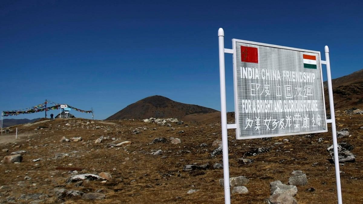 <div class="paragraphs"><p>A signboard is seen from the Indian side of the Indo-China border at Bumla.</p></div>