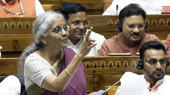 <div class="paragraphs"><p>Union Finance Minister Nirmala Sitharaman speaks in the Lok Sabha during the Monsoon session of Parliament, in New Delhi, Tuesday.&nbsp;</p></div>