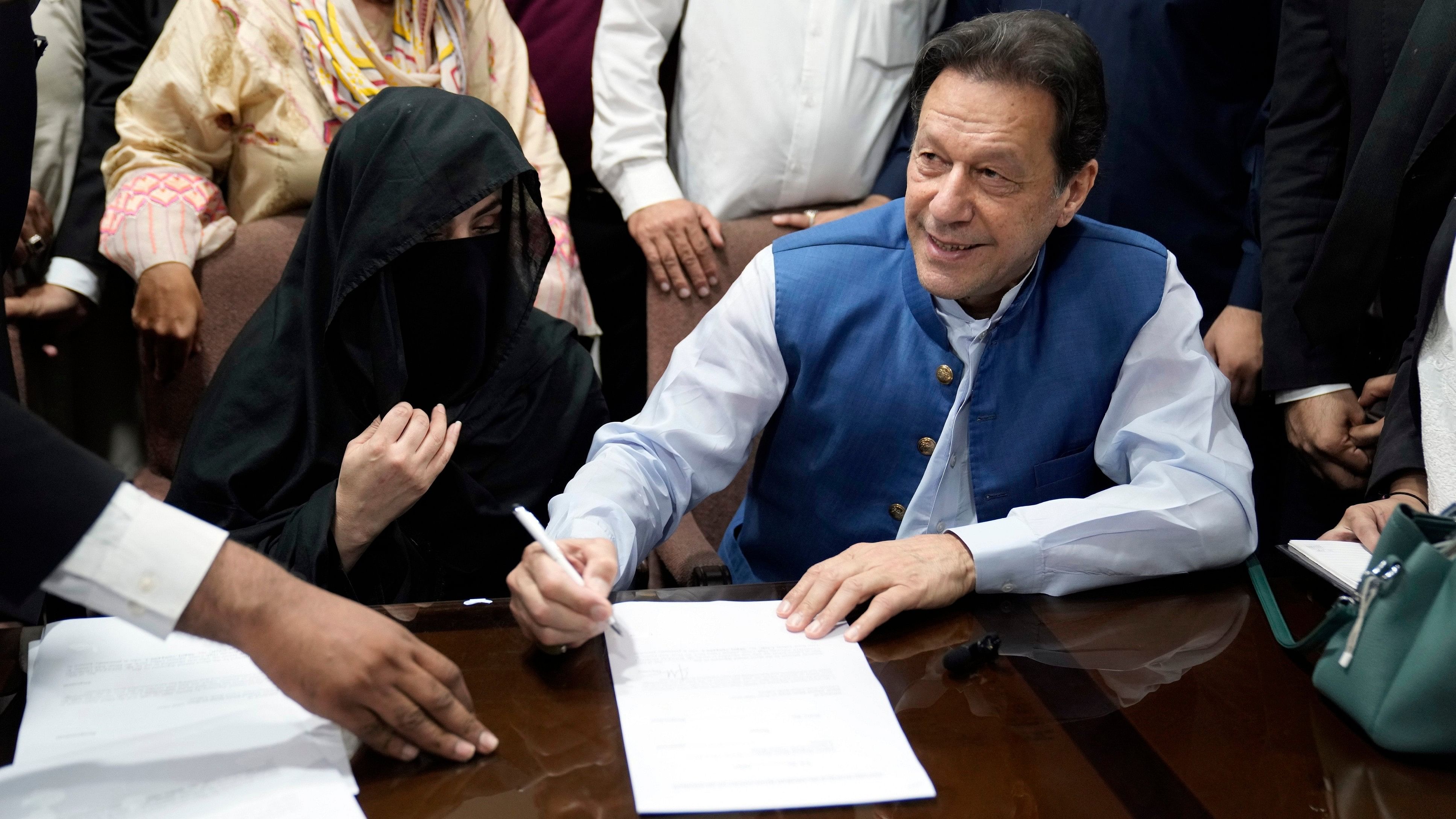 <div class="paragraphs"><p> Pakistan's former Prime Minister Imran Khan along with his wife Bushra Bibi.</p></div>