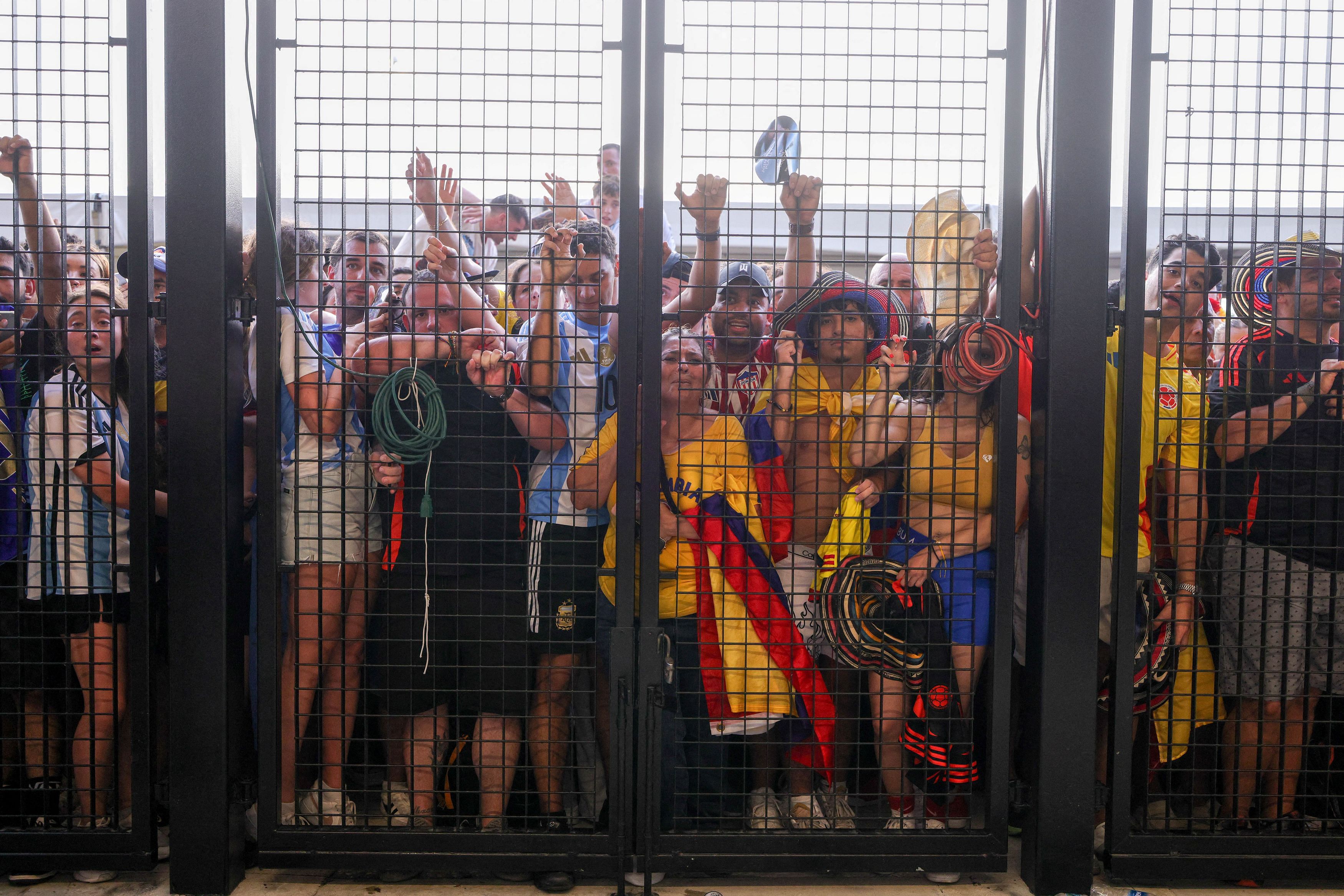 <div class="paragraphs"><p>Fans push up against the gates before the Copa America Finals match between Argentina and Colombia at Hard Rock Stadium. Mandatory </p></div>