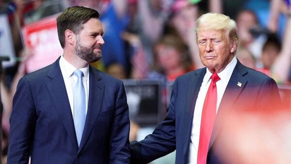 <div class="paragraphs"><p>Republican presidential nominee and former U.S. President Donald Trump stands with Republican vice presidential nominee U.S. Senator J.D. Vance (R-OH), as he holds a rally for the first time with his running mate, in Grand Rapids, Michigan</p></div>