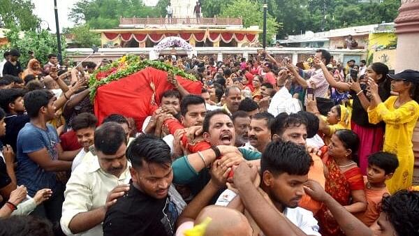 <div class="paragraphs"><p>Devotees take part in ‘Palki Yatra’ on the eve of the annual Rath Yatra festival.</p></div>