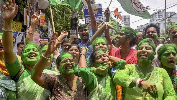 <div class="paragraphs"><p>TMC supporters celebrate as party candidate Supti Pandey from Maniktala constituency leads during counting of votes for Assembly by-election, in Kolkata, Saturday, July 13, 2024. </p></div>