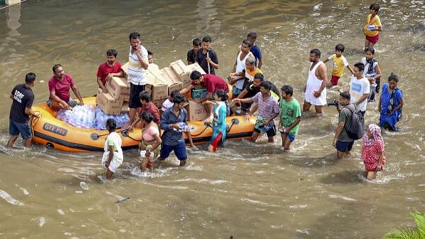 <div class="paragraphs"><p>SDRF personnel distribute relief material to flood-affected people, in Guwahati, Friday, July 5, 2024.</p></div>